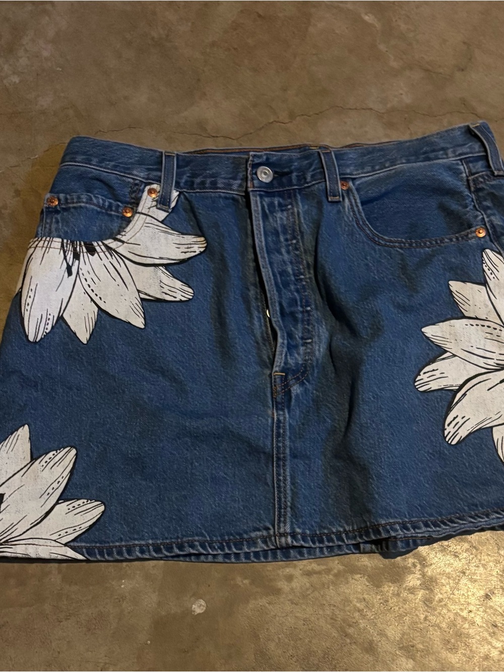 Levi's Blue Denim Mini Skirt with White Floral Accents